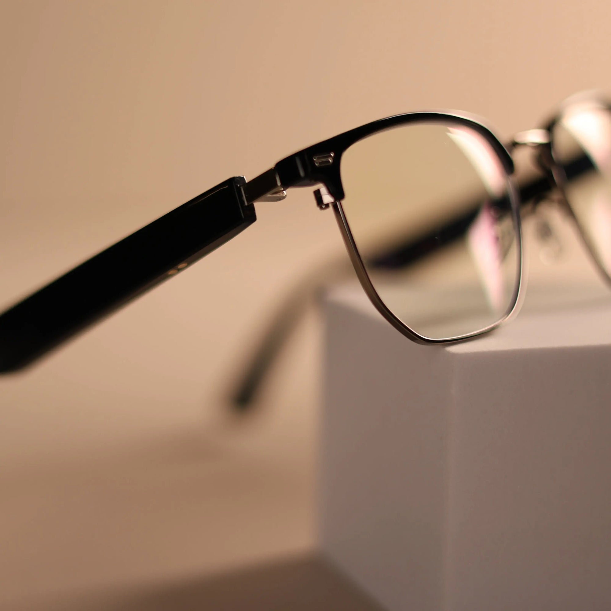 Side view of DUSK Halo smart glasses showing sleek black frame and blue light filtering lenses